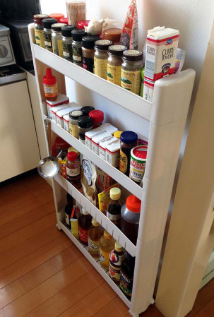This spice rack is amazing and actually meant to slide into the gap between your counter and your fridge.